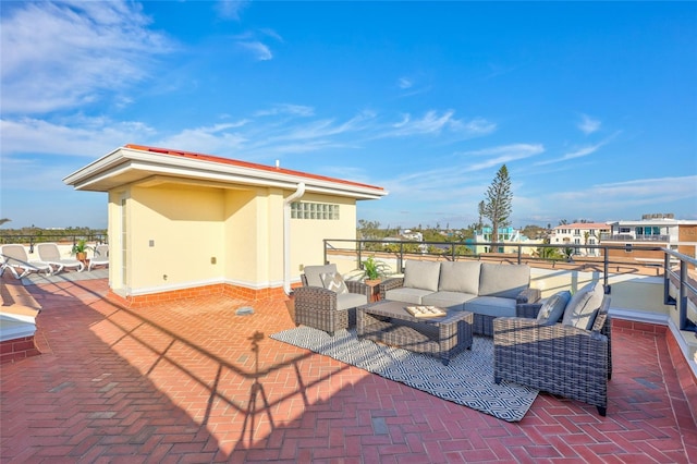 view of patio featuring a balcony and an outdoor living space