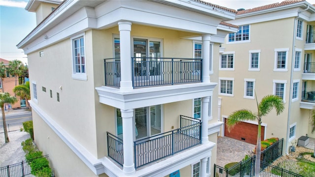 view of side of property with a balcony