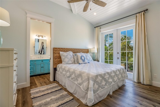 bedroom featuring dark hardwood / wood-style floors, connected bathroom, lofted ceiling, access to exterior, and french doors