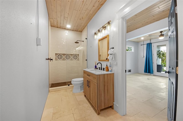 bathroom with tiled shower, vanity, and wooden ceiling