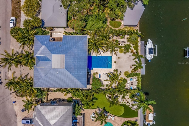 birds eye view of property with a water view