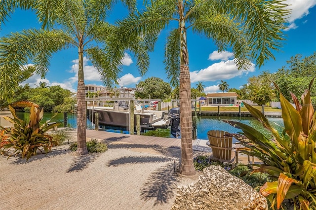 exterior space featuring a water view and a dock