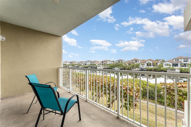 balcony featuring a water view