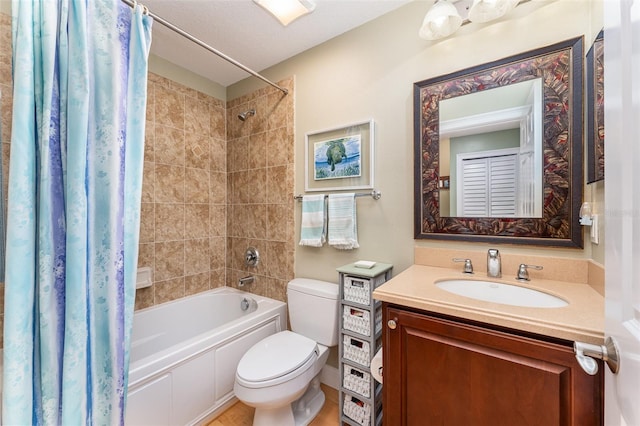 bathroom featuring toilet, vanity, and shower / bath combination with curtain