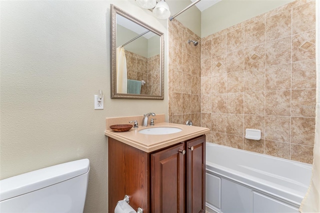bathroom with shower / bathtub combination with curtain, vanity, and toilet
