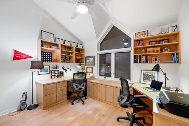 office space featuring ceiling fan, vaulted ceiling, and light wood-type flooring