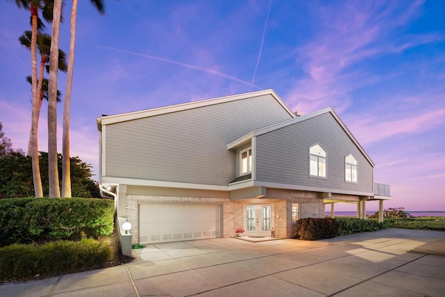 view of front of home featuring french doors and a garage