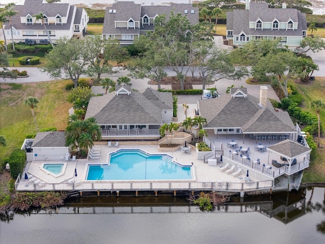 birds eye view of property featuring a water view