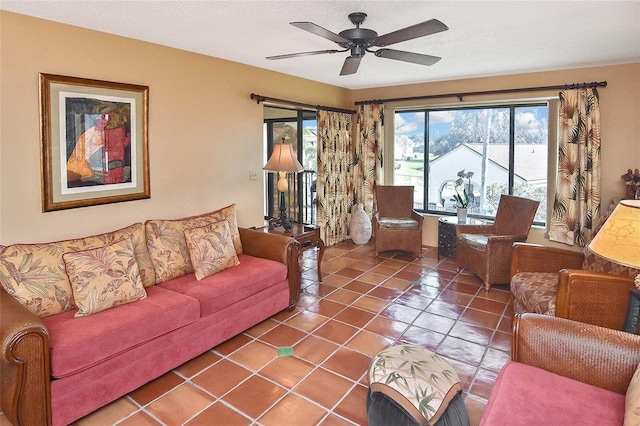 living room featuring ceiling fan and tile patterned flooring