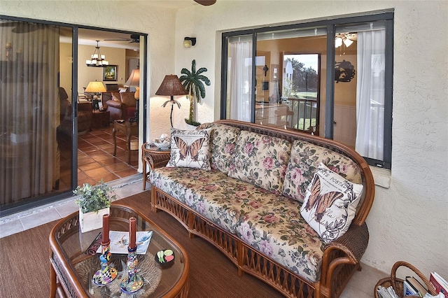 living room with tile patterned floors and ceiling fan