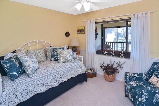 carpeted bedroom with access to exterior and ceiling fan