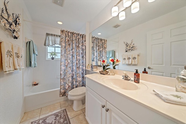 full bathroom with tile patterned flooring, vanity, toilet, and shower / bath combo with shower curtain