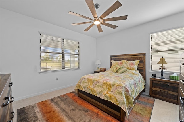 bedroom with light tile patterned flooring and ceiling fan