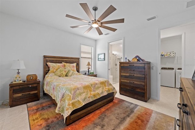 bedroom with light tile patterned flooring, ceiling fan, separate washer and dryer, and ensuite bath