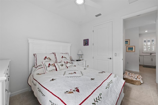 bedroom with light tile patterned flooring and ceiling fan