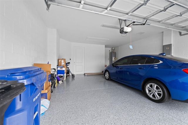 garage with a garage door opener, electric panel, and gas water heater