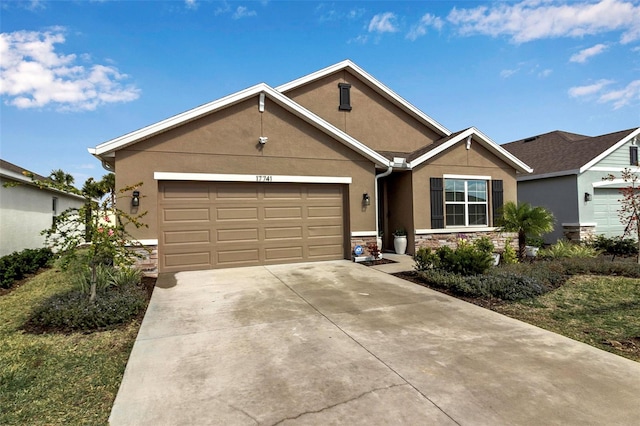 ranch-style home featuring a garage