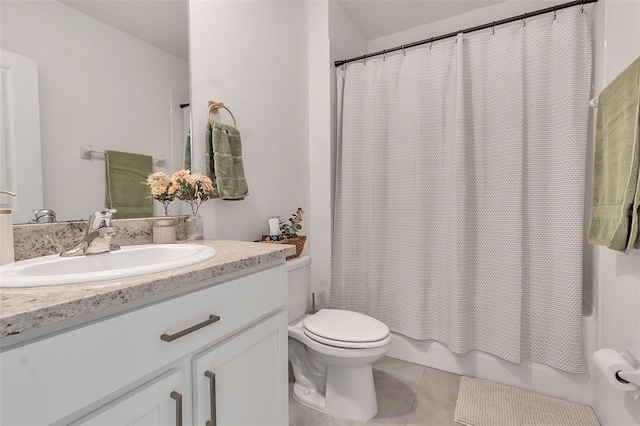 bathroom featuring toilet, tile patterned flooring, shower / bath combo with shower curtain, and vanity