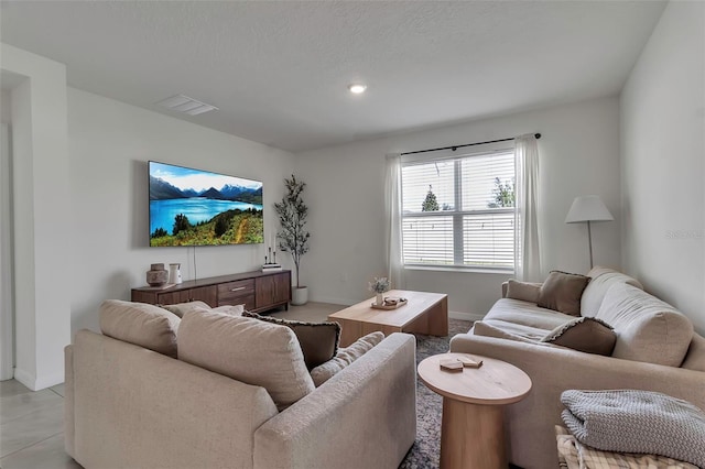 living area with visible vents and baseboards