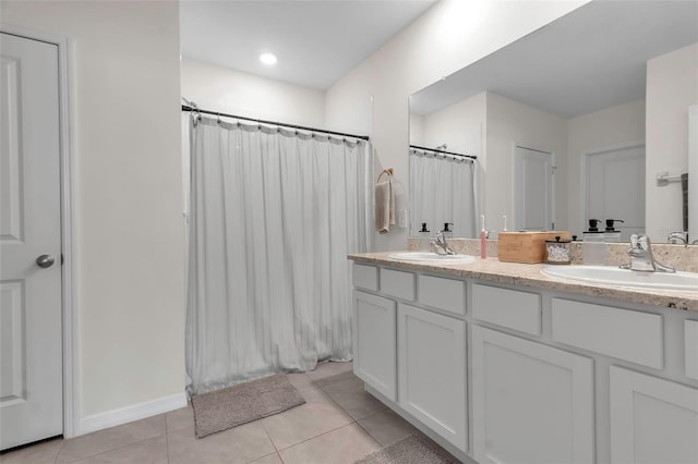 full bath with double vanity, tile patterned flooring, a sink, and a shower with curtain