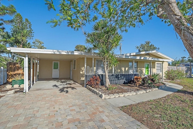 view of front of home with a carport