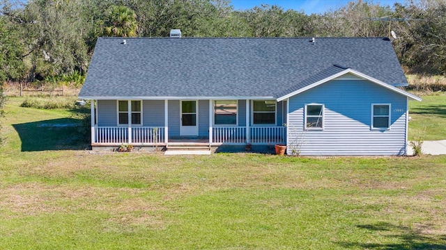 view of front of house featuring a front lawn and covered porch