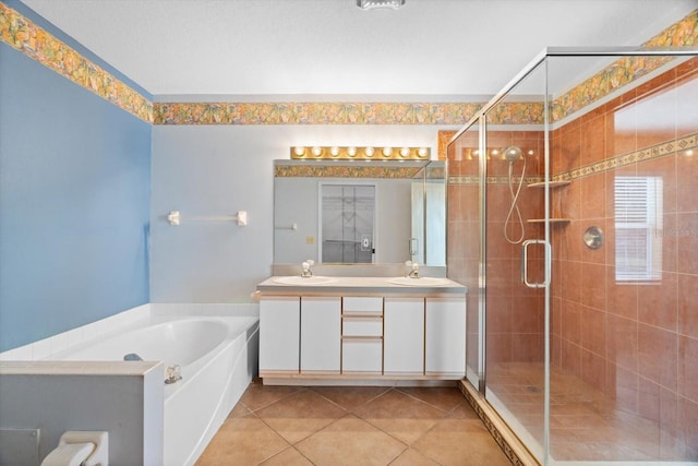 bathroom with tile patterned flooring, vanity, and shower with separate bathtub