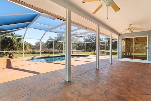 view of swimming pool featuring a lanai, a patio area, and ceiling fan