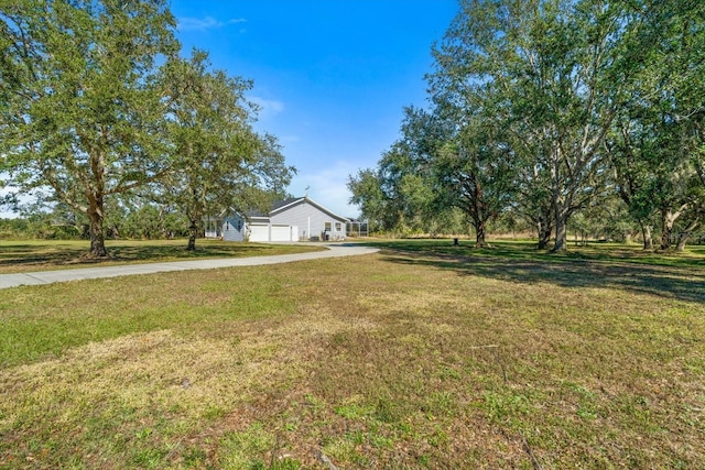 view of yard featuring a garage