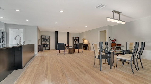 dining room featuring light hardwood / wood-style floors