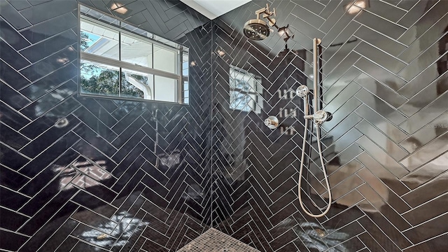 bathroom with a tile shower