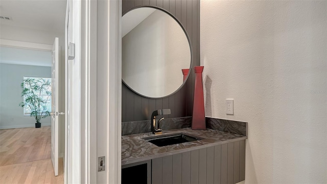 bathroom featuring vanity and wood-type flooring