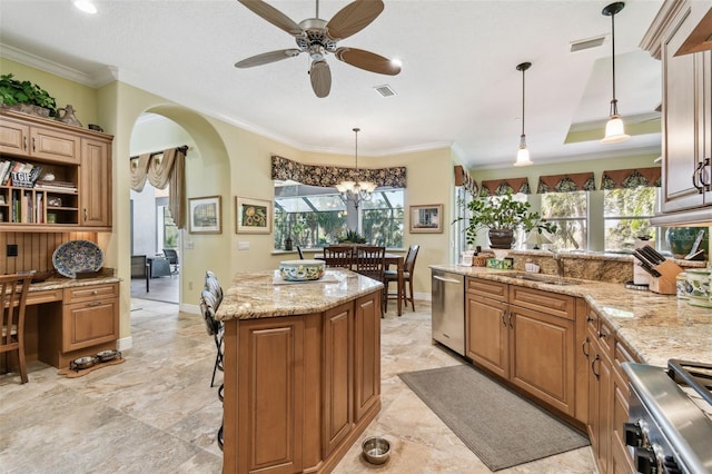 kitchen featuring a kitchen island, pendant lighting, dishwasher, sink, and stove