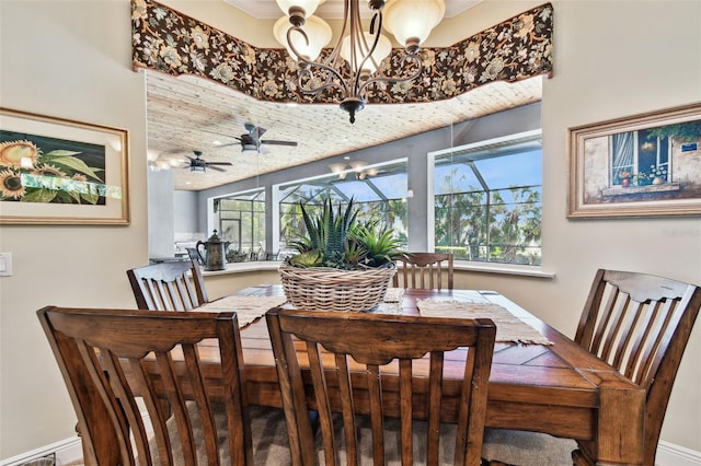 dining room with ceiling fan with notable chandelier and wood ceiling