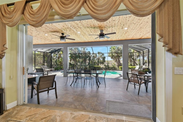 sunroom with a pool and wood ceiling