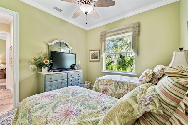 bedroom featuring ornamental molding and ceiling fan