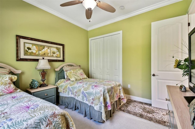 carpeted bedroom with crown molding, a closet, and ceiling fan