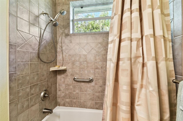 bathroom with shower / bath combination with curtain