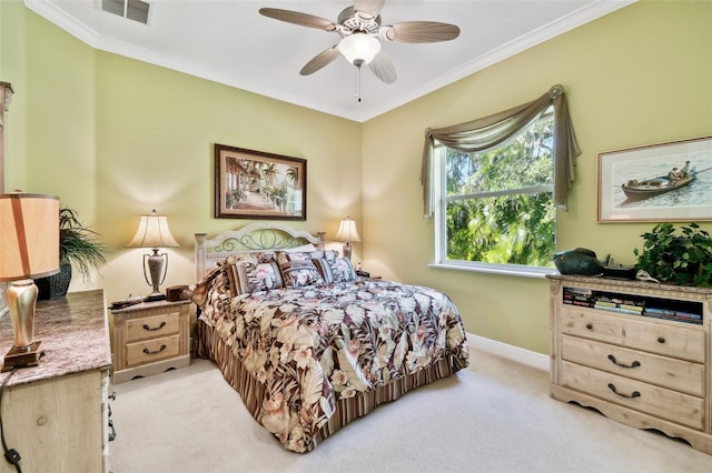 bedroom featuring crown molding, light carpet, and ceiling fan