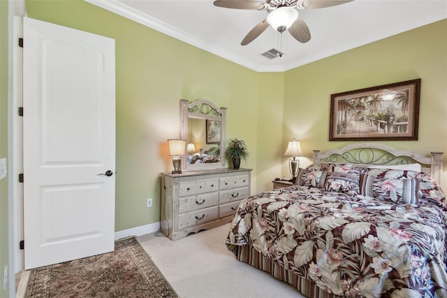 bedroom with crown molding, light colored carpet, and ceiling fan