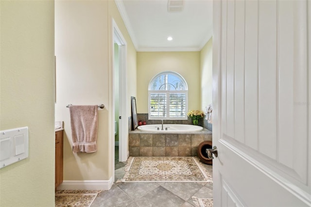 bathroom with vanity, a relaxing tiled tub, toilet, crown molding, and tile patterned floors