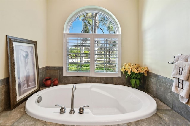 bathroom featuring a relaxing tiled tub