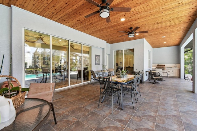 sunroom / solarium featuring wood ceiling