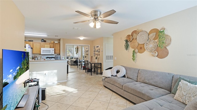 tiled living room featuring ceiling fan