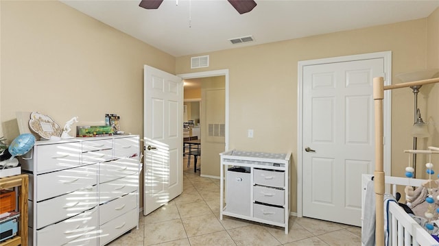 bedroom with light tile patterned floors and ceiling fan