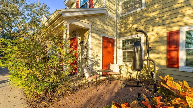 entrance to property with a patio area