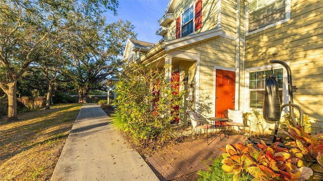 entrance to property featuring a patio area