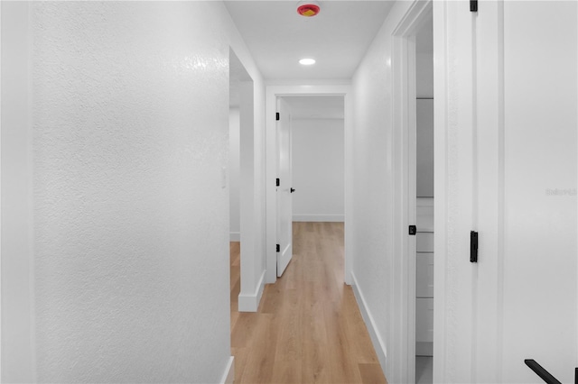 corridor featuring light hardwood / wood-style flooring