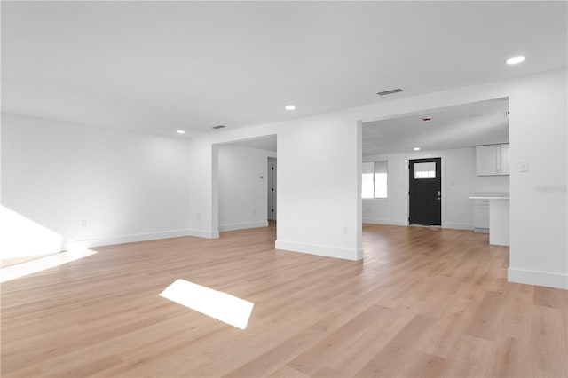 unfurnished living room featuring light hardwood / wood-style floors