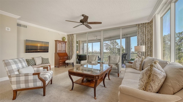 living room with crown molding, light tile patterned floors, and a textured ceiling